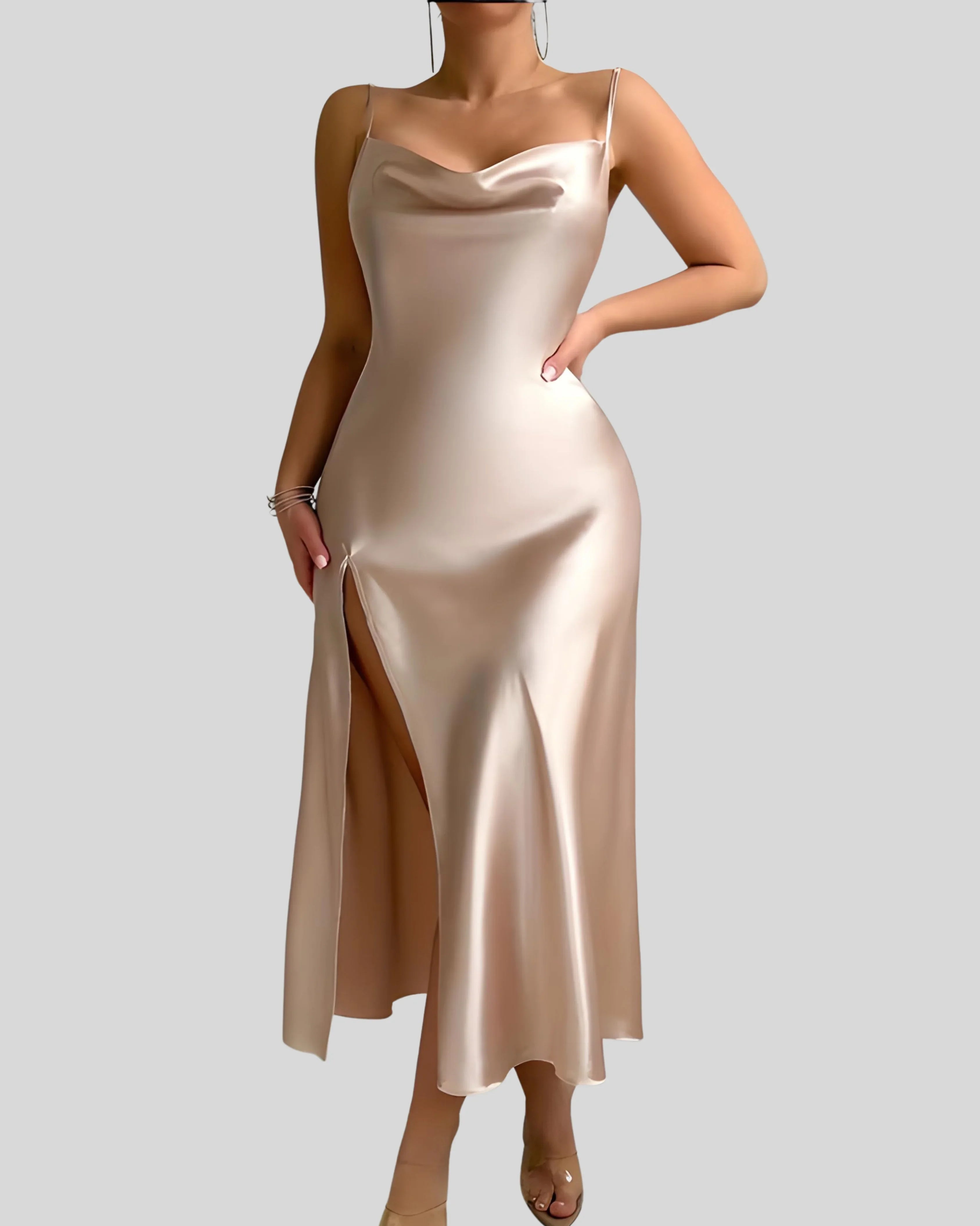 Woman wearing a champagne-colored satin slip dress with spaghetti straps and thigh-high slit, styled with bracelets and hoop earrings